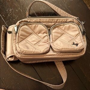EUC Lug Crossbody Bag in Beige/tan w/blue/navy and white seashell interior patt.